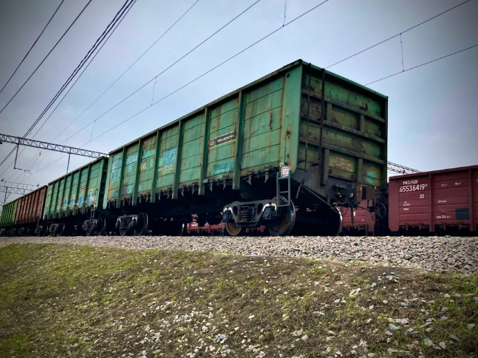 a train car sitting on top of a train track